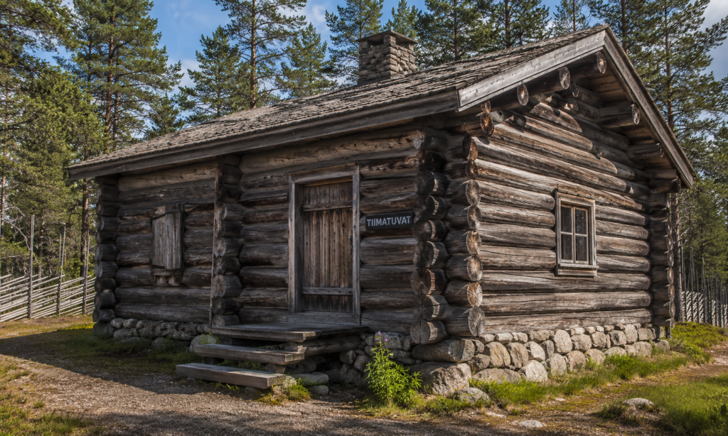 Tiimatuvat traditional Finnish log building in winter forest